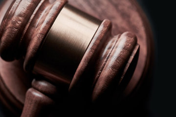 bill-oxford-OXGhu60NwxU-unsplash Judge's gavel on black background