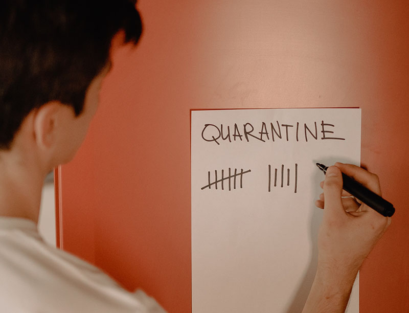 Man marking off quarantine days