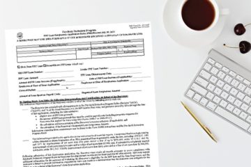 PPP Loan Forgiveness Application-01 PPP Loan Forgiveness Paper Application on Desk